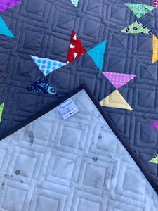 Available now: rainbow stars quilt dark grey background, Twin size