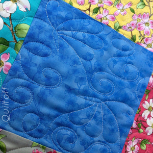 Available now: baby quilt, bright, scrappy look, floral, dogwood
