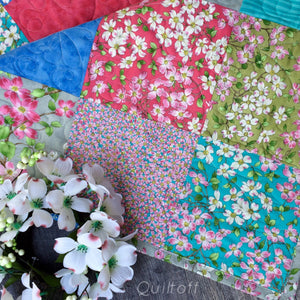 Available now: baby quilt, bright, scrappy look, floral, dogwood