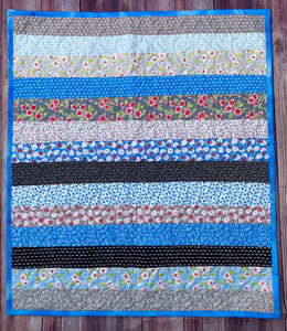 Available now: strips baby quilt, blue black ruby