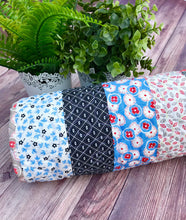 Load image into Gallery viewer, Available now: strips baby quilt, blue black ruby
