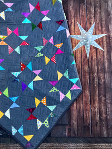 Available now: rainbow stars quilt dark grey background, Twin size
