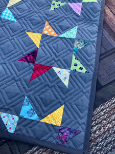 Available now: rainbow stars quilt dark grey background, Twin size